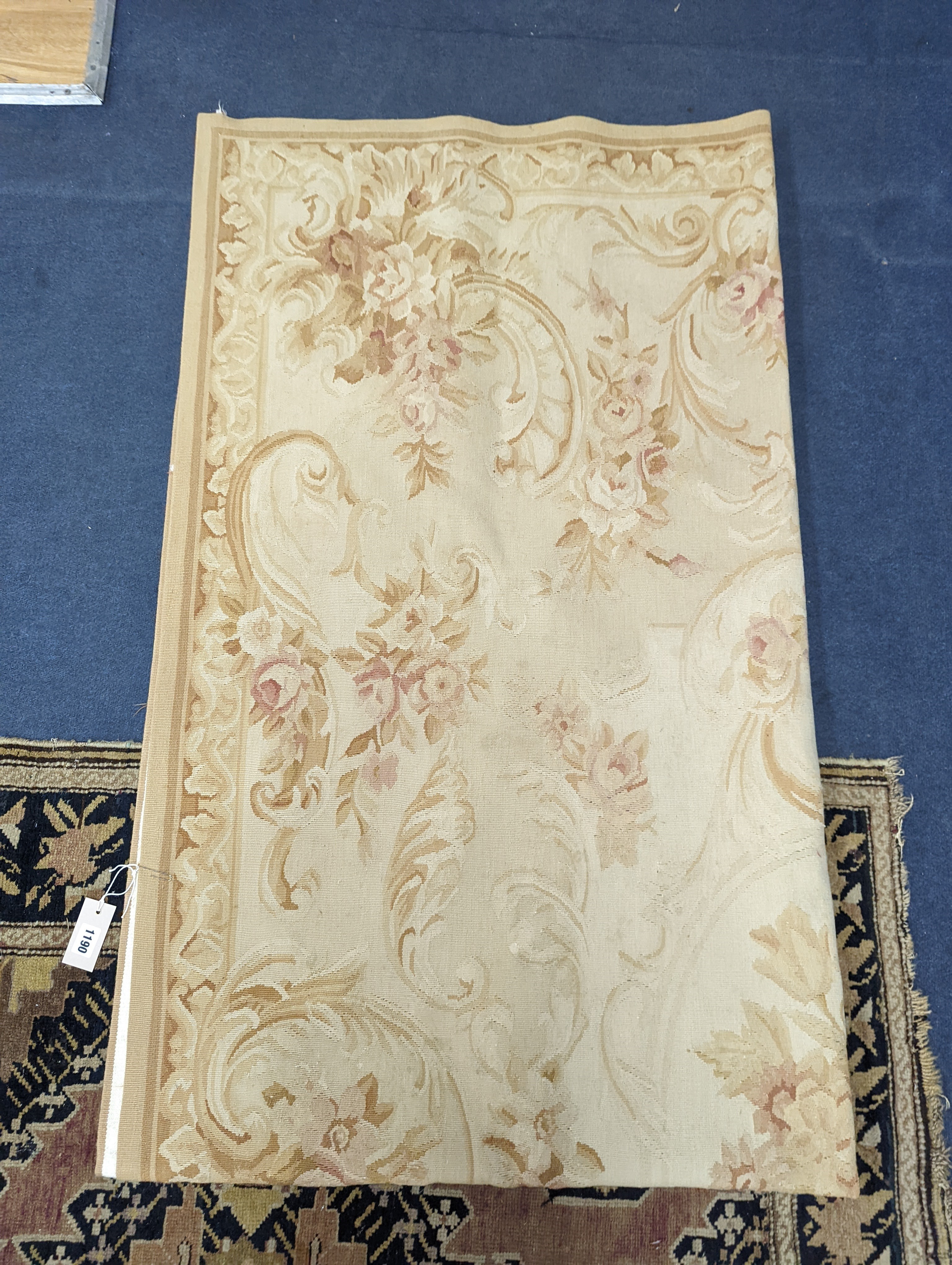An Aubusson gold ground rug with rose pattern, 244 x 153cm